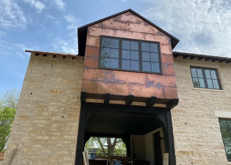 Copper metal panel facade on a stone building for Roof Repair in Dade City
