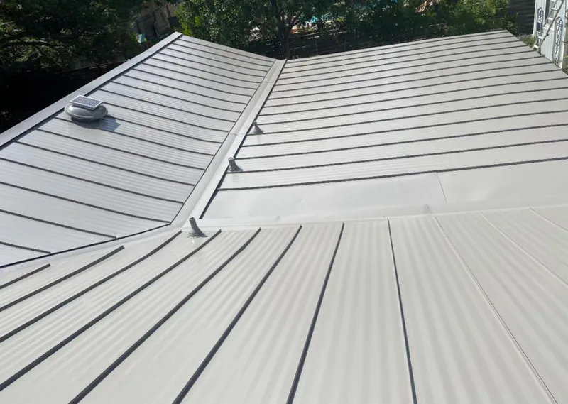 Solar attic fan installed on a metal roof for Roof Ventilation in Dade City